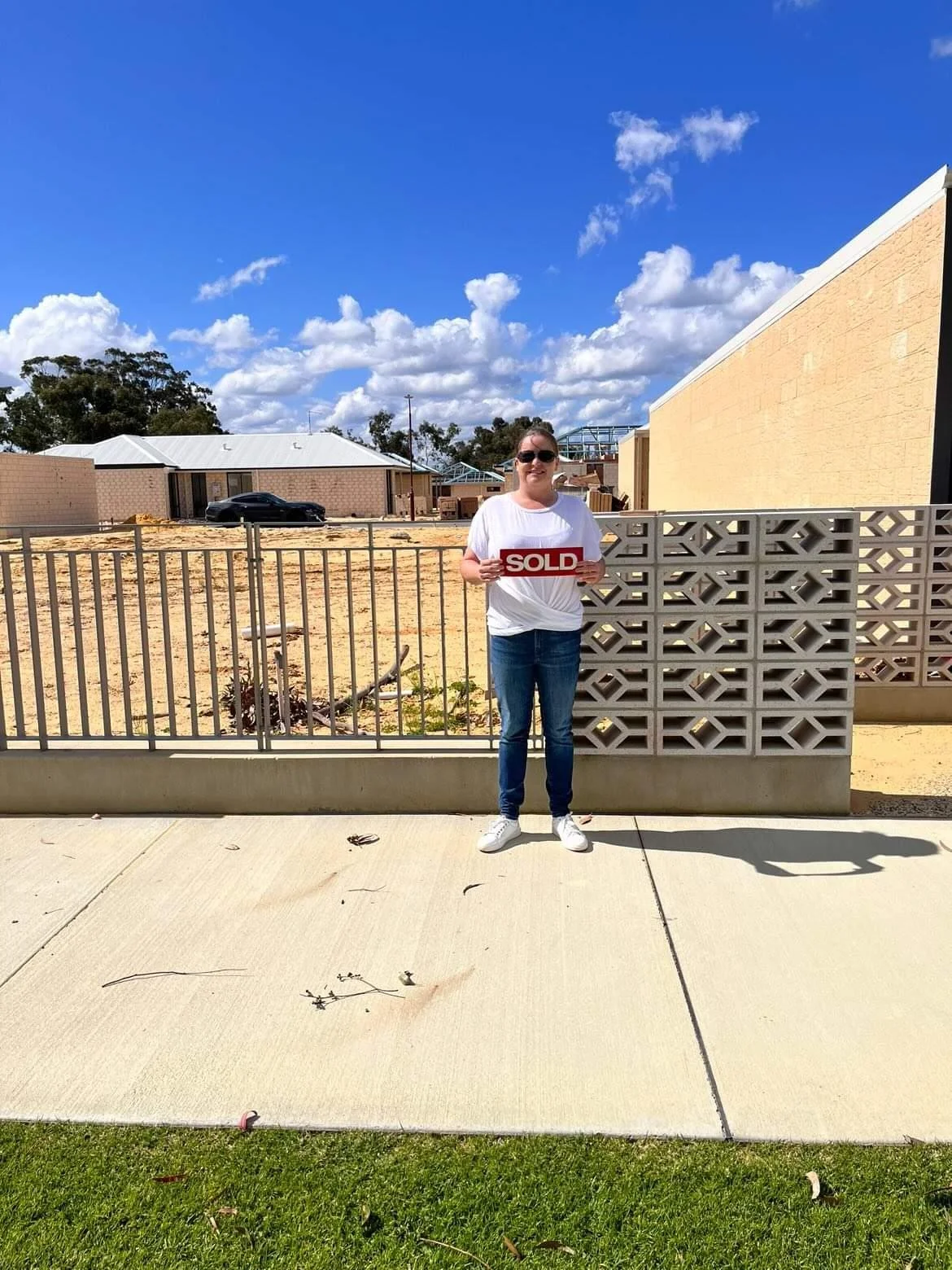 Matched Homes client standing outside a completed home